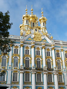 white and gold painted multi-storey building thumbnail