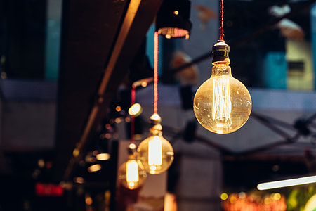 selective focus photography of orange hanging lights thumbnail