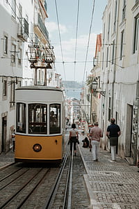 people walking beside train railway thumbnail
