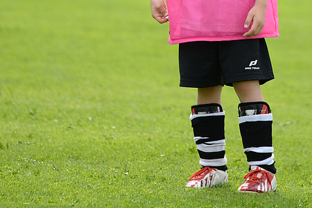 boy wearing black knee guards thumbnail