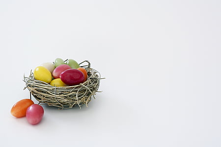 white wicker birds nest and assorted-color eggs thumbnail