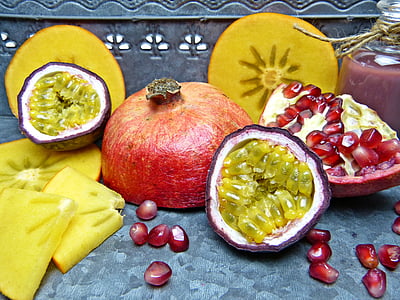sliced pomegranate on grey surface thumbnail