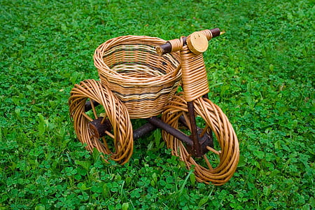 woven trike basket on grass field thumbnail