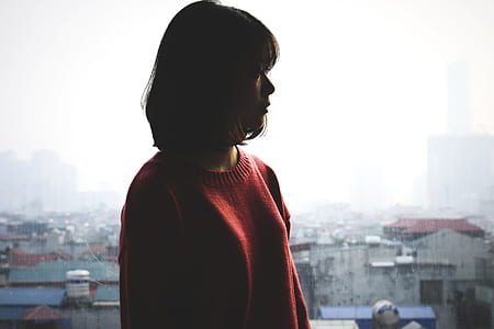 woman standing near buildings thumbnail
