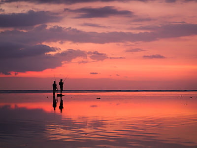 silhouette of man fishing during golden hour thumbnail