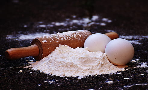 brown rolling pin and two white eggs thumbnail