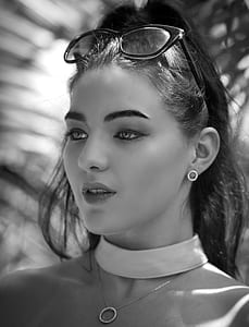 grayscale photo of woman wearing top and eyeglasses thumbnail