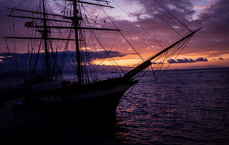 silhouette of galleon during sunset thumbnail