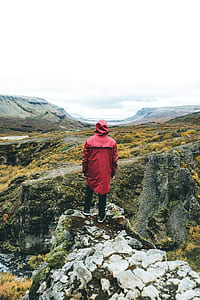 man standing on mountain edge thumbnail