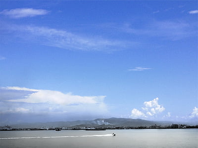 photography of person on body of water at daytime thumbnail