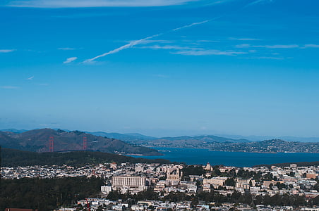 top view photo of buildings near body of water thumbnail