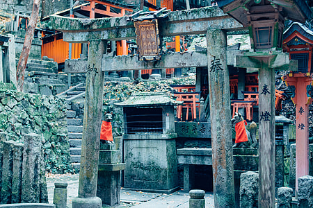 two dog statues beside paifang during daytime thumbnail