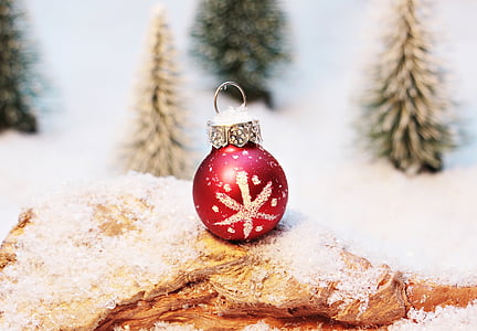 white and red christmas bauble place on wooden trunk thumbnail
