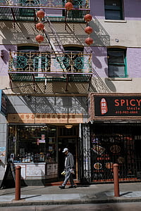 man walking in front of building thumbnail