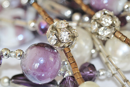 beaded silver-colored, brown, and purple accessory close-up photo thumbnail