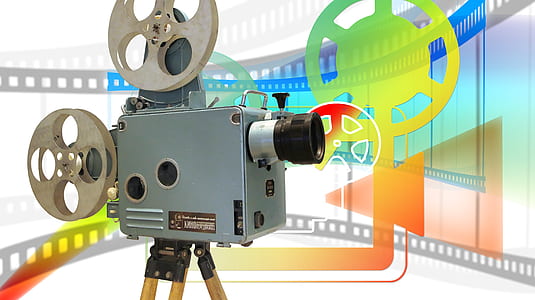 gray and black reel-to-reel projector thumbnail