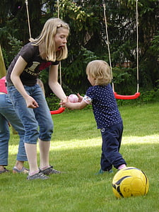 girl holding pink and white ball thumbnail