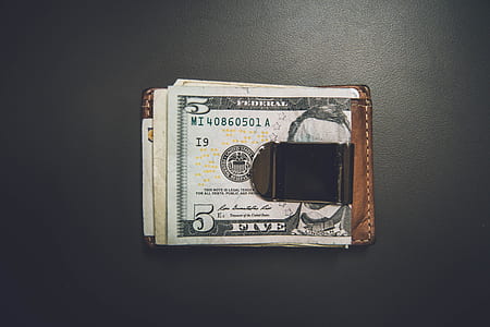 5 U.S dollar banknote on wallet thumbnail