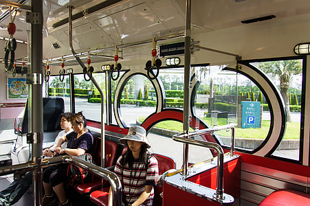 three people riding vehicle during daytime thumbnail