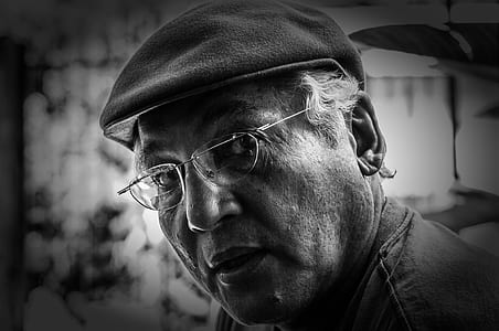 grayscale photography of man in beret and eyeglasses thumbnail