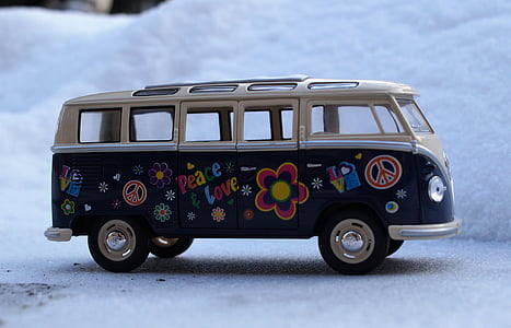 blue and white Volkswagen T1 van die-cast toy on snow thumbnail