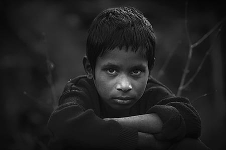 Grayscale Photo of Boy in Long-sleeved Shirt thumbnail
