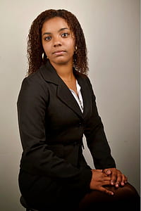 woman wearing black notched lapel blazer posing for a photo thumbnail