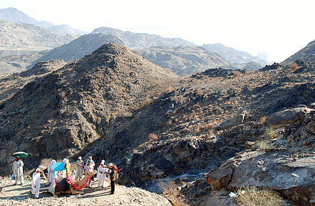 group of people standing on mountain thumbnail