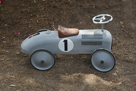white and black ride-on car on brown soil thumbnail