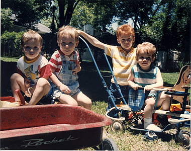 four children sitting near each other thumbnail
