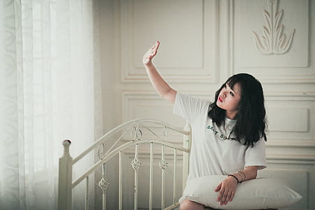 woman wearing white crew-neck t-shirt thumbnail