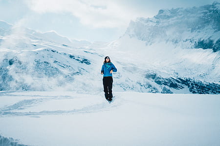 woman standing on snowfield thumbnail