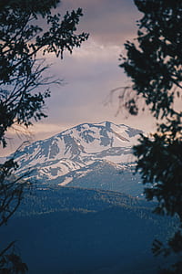 snowed mountain under white clouds at daytime thumbnail