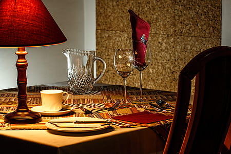 clear wine glass on brown table thumbnail