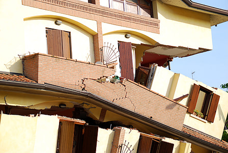 demolished white and brown painted building thumbnail