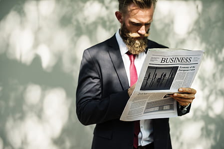 man holding Business newspaper print thumbnail