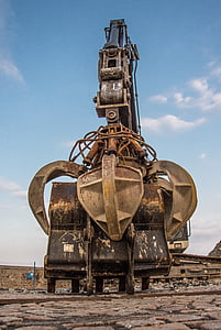 grey and black industrial machine holding black bucket thumbnail