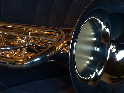 shallow focus photography of chrome musical instrument thumbnail