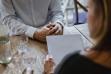 Two business partners sitting in cafe and discussing contract thumbnail