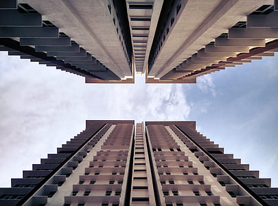 high angle photography of two beige-and-gray high rise buildings thumbnail