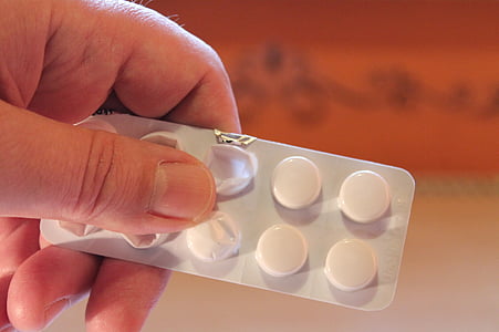 person holding blister pack thumbnail