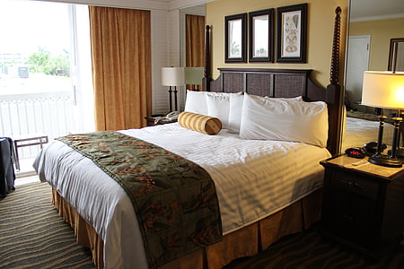 brown wooden bed frame and mattress thumbnail