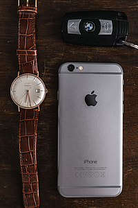 Apple iPhone 6 and Vintage watch on a brown leather wallet thumbnail