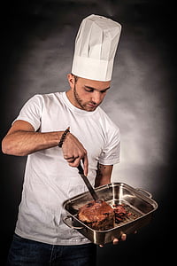 man wearing chef cup holding gray tray thumbnail