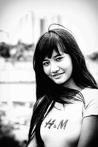 gray scale photography of smiling woman thumbnail