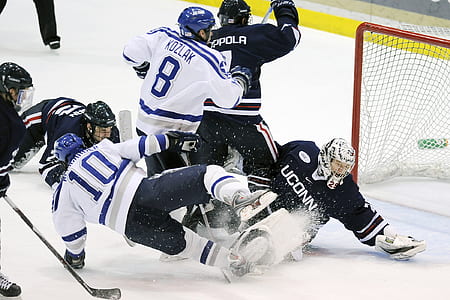 ice hockey players playing on ice rink thumbnail