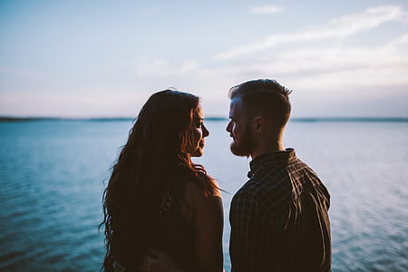 man and woman standing beside the lake thumbnail