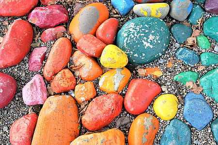 assorted-color stone lot on sand thumbnail