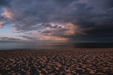gray sands near the ocean waters thumbnail