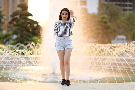 woman standing in front of water fountain thumbnail
